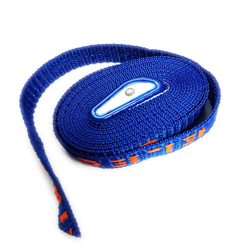 A rolled-up blue roof rack tiedown with an orange pattern and a plastic buckle