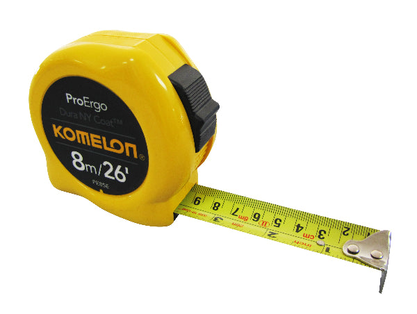 A yellow Komelon branded measuring tape with a black plastic case, extended to show length markings.